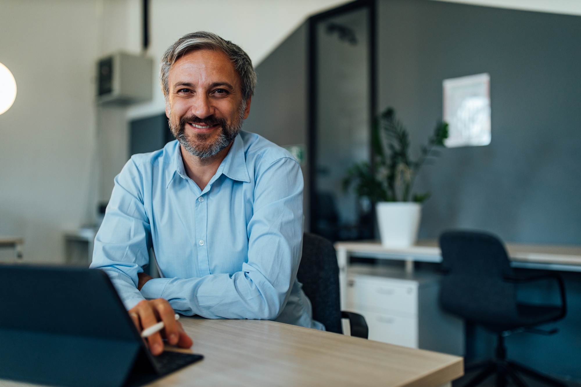 Portrait of men in a blue shirt with happy face.